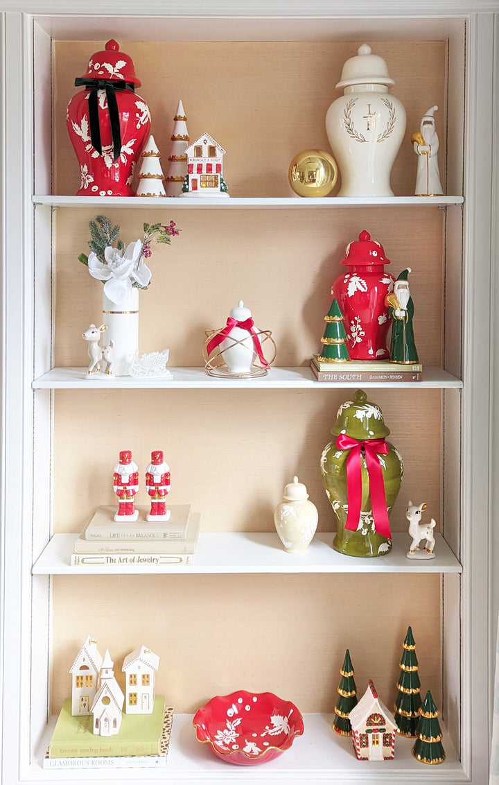 Decorative shelves with various small figurines and ornaments on a beige wall.
