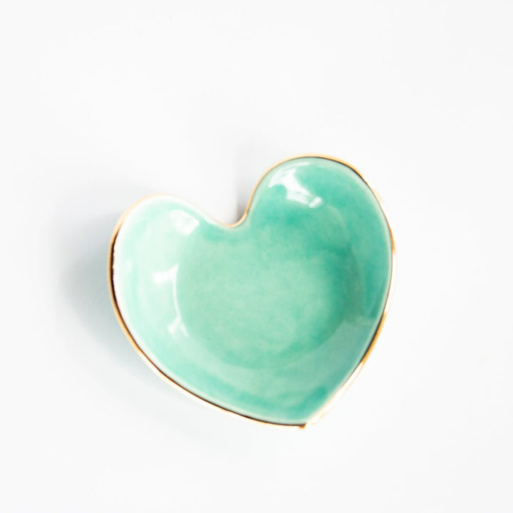Seafoam jade heart ring dish with a glossy glaze and gold rim