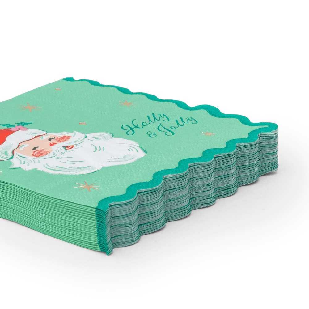 Stack of jolly Santa Christmas napkins showing the red and green folded edges