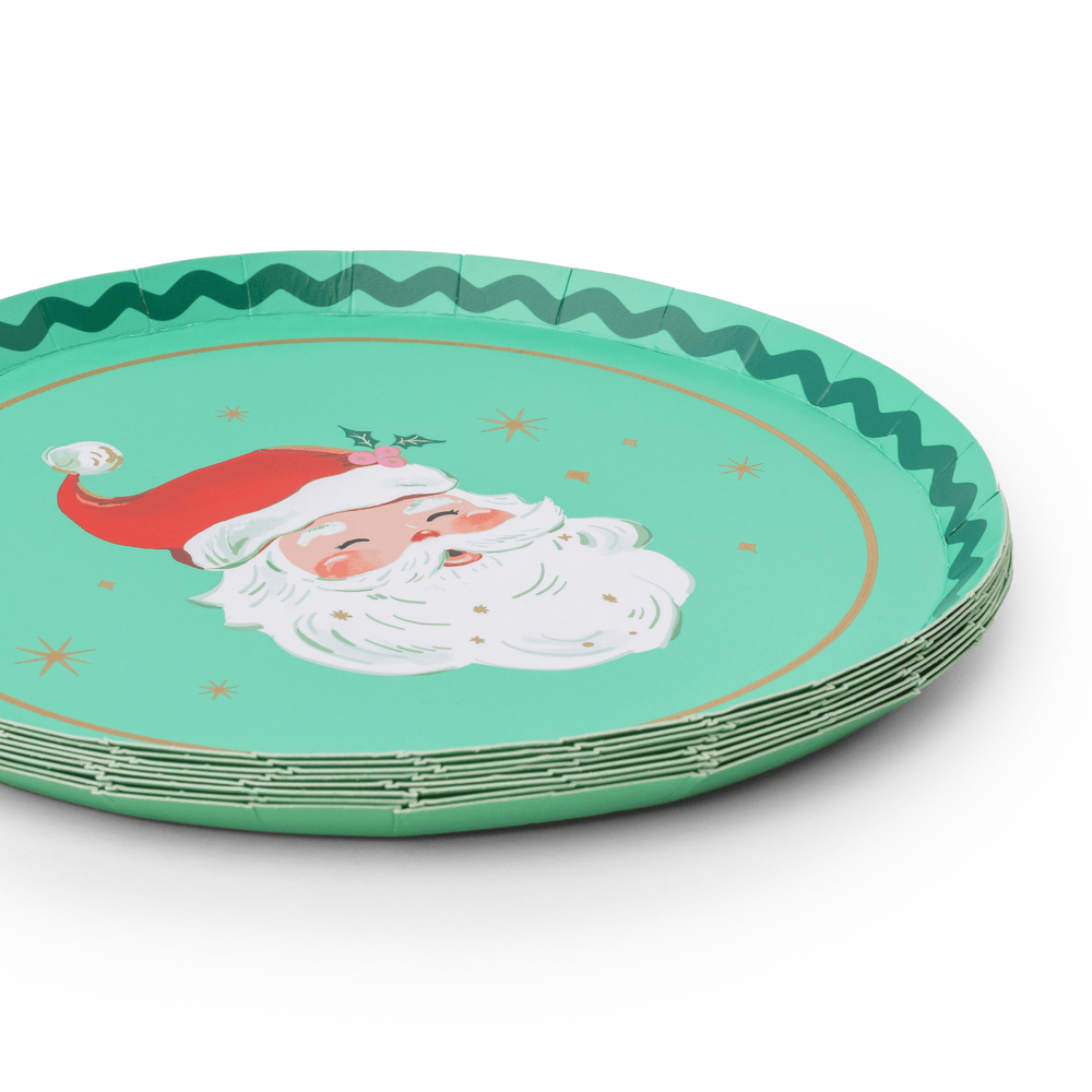 Stack of jolly Santa Christmas plates showing the red and green rim design