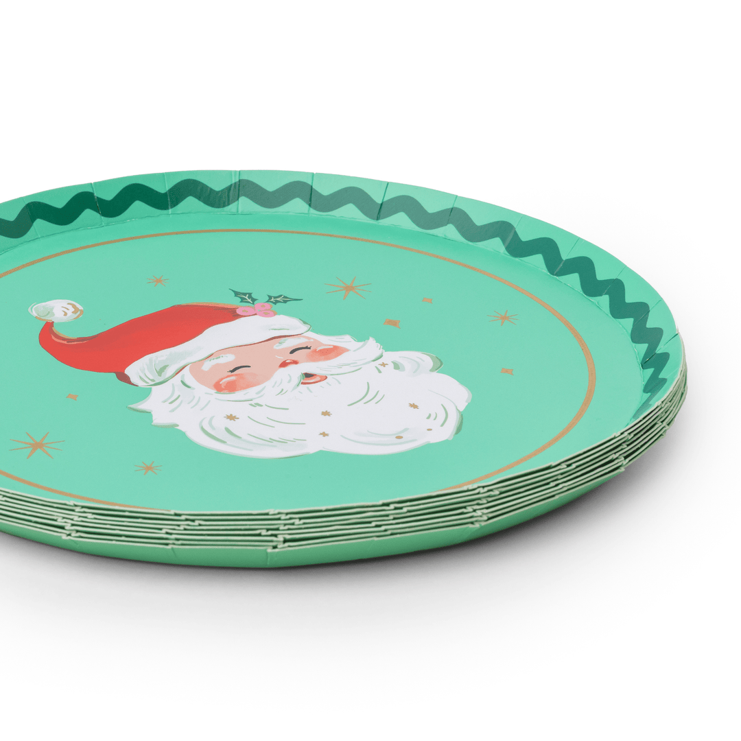 Stack of jolly Santa Christmas plates showing the red and green rim design