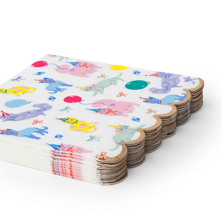 Stack of kitty cat party napkins showing the folded pastel print edges