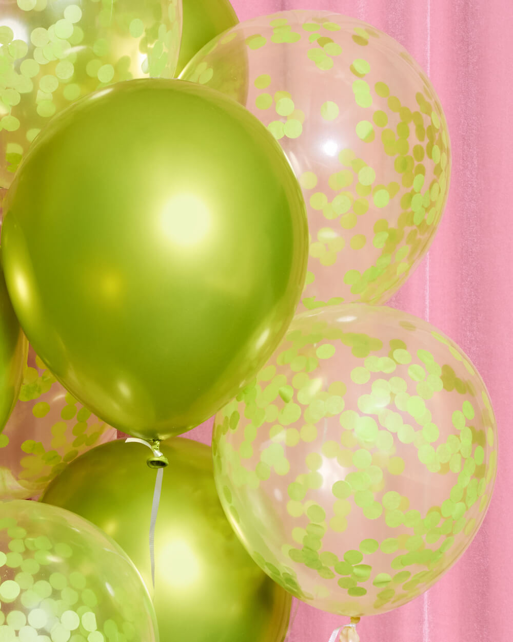 Styled lime green confetti latex balloons for a bold birthday or bachelorette