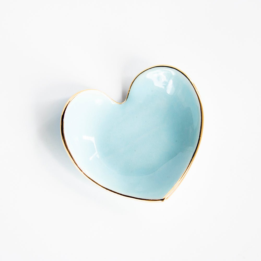 Soft sky blue heart ring dish with a gold rim, top view