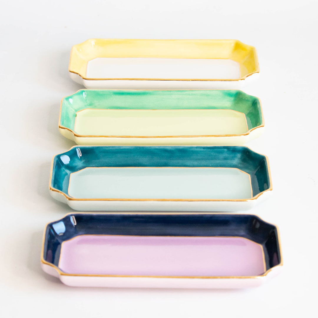 Yellow, mint, teal, and navy with lavender petite valet trays stacked in a colorful row, for gifting