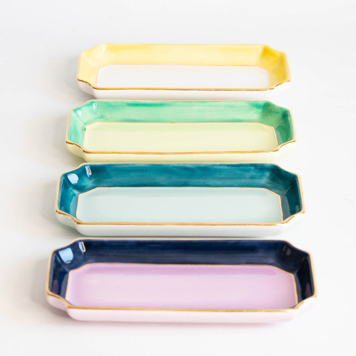 Yellow, mint, teal, and navy with lavender petite valet trays stacked in a colorful row, for gifting