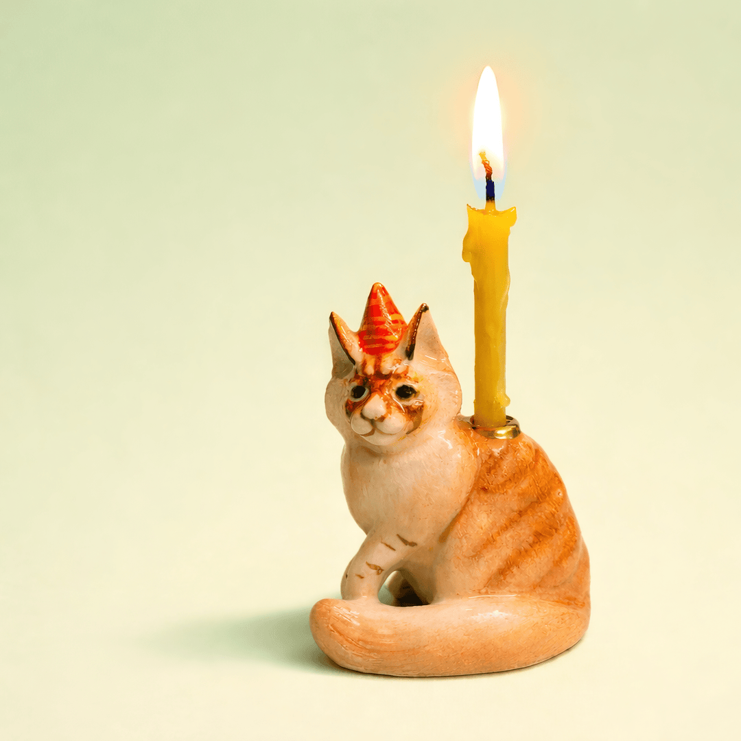 Maine coon cat porcelain cake topper candle holder in a party hat, a birthday cake topper for cat lovers