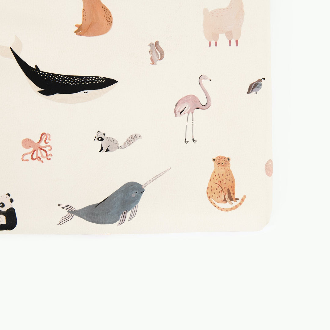 Close-up of the Menagerie animal print padded play mat with a whale, flamingo, narwhal, cheetah, and octopus