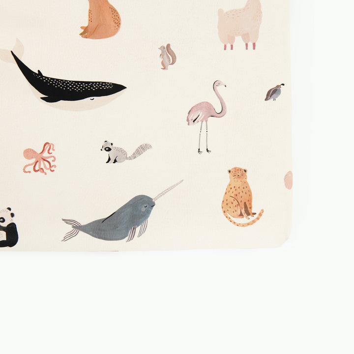 Close-up of the Menagerie animal print padded play mat with a whale, flamingo, narwhal, cheetah, and octopus