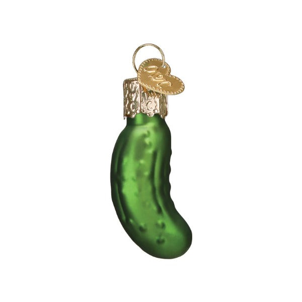 Mini green glass pickle ornament with a glossy bumpy finish and gold cap, on white