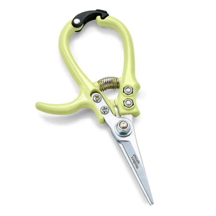 Chartreuse needle-nose garden shears with closed straight blades and a coil spring on white