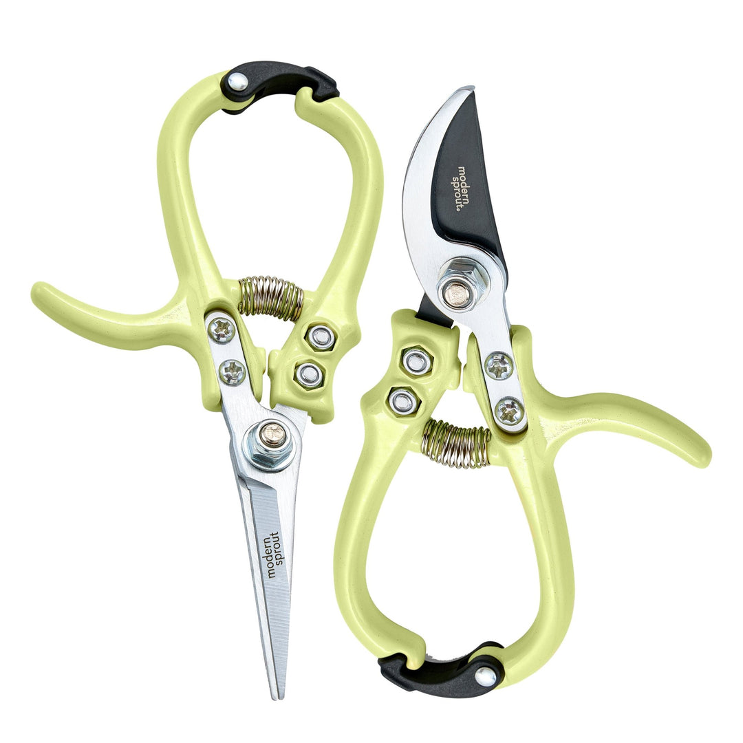 Chartreuse needle-nose shears and bypass pruners arranged in opposite directions on white