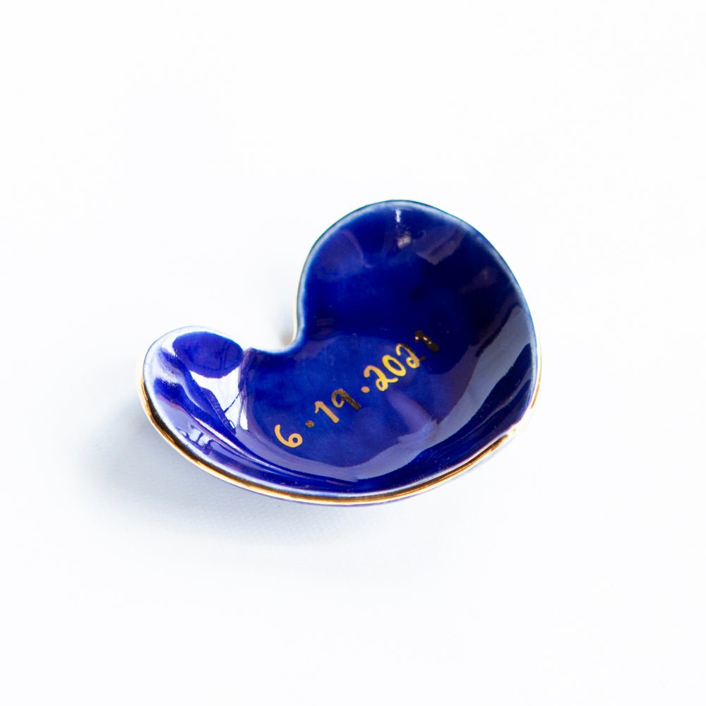 Cobalt heart dish personalized with a handwritten gold date on the glaze