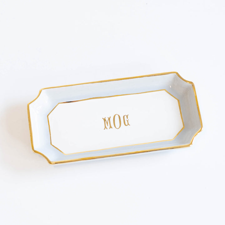 Light gray petite valet tray with a gold monogram in the center, a personalized wedding party gift