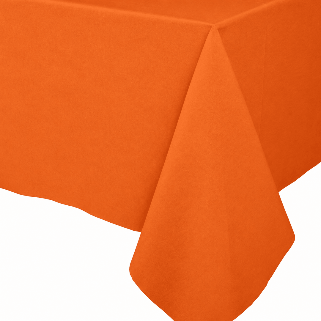 Bright orange tablecloth draped over a table, shown against a plain white background.
