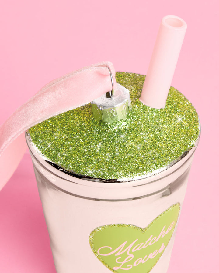 Another view of the mirrored silver to-go cup ornament and its green Matcha Lover heart.