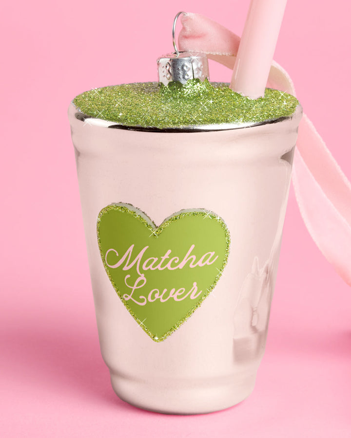 Additional view of the matcha cup ornament hanging from its pink velvet ribbon.