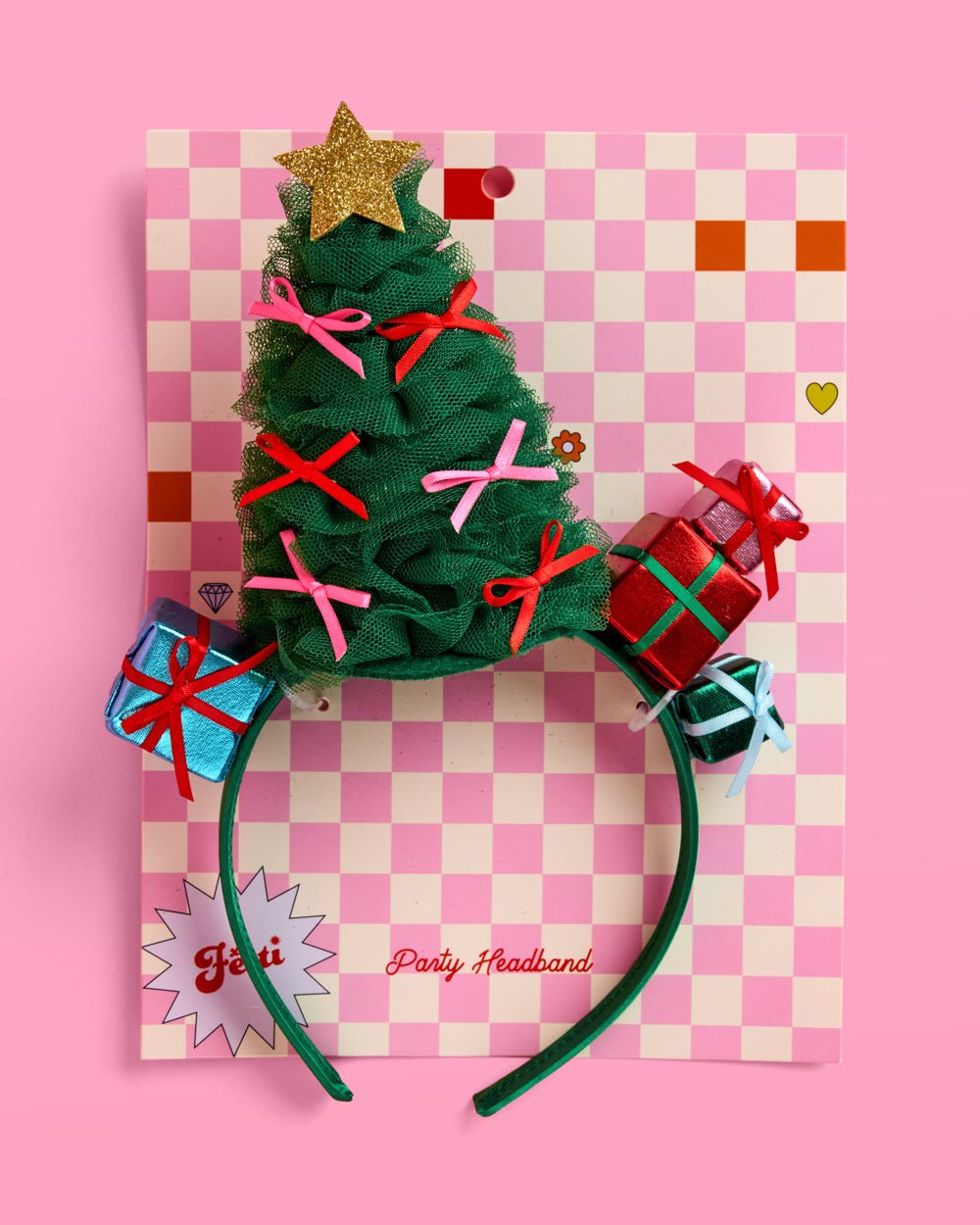 Green tulle Christmas tree headband on its checkered party headband card