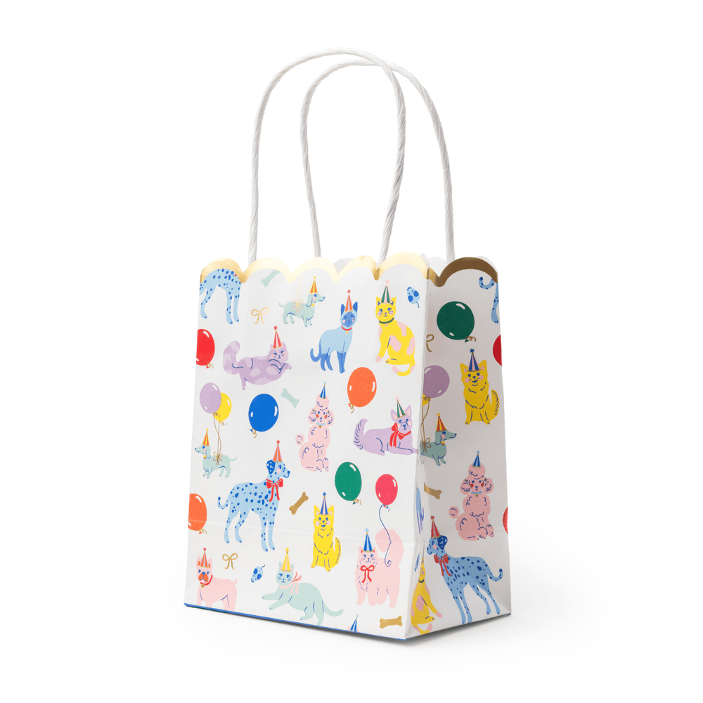 Stack of party animals favor bags showing the colorful animal print