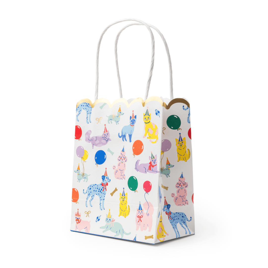 Stack of party animals favor bags showing the colorful animal print