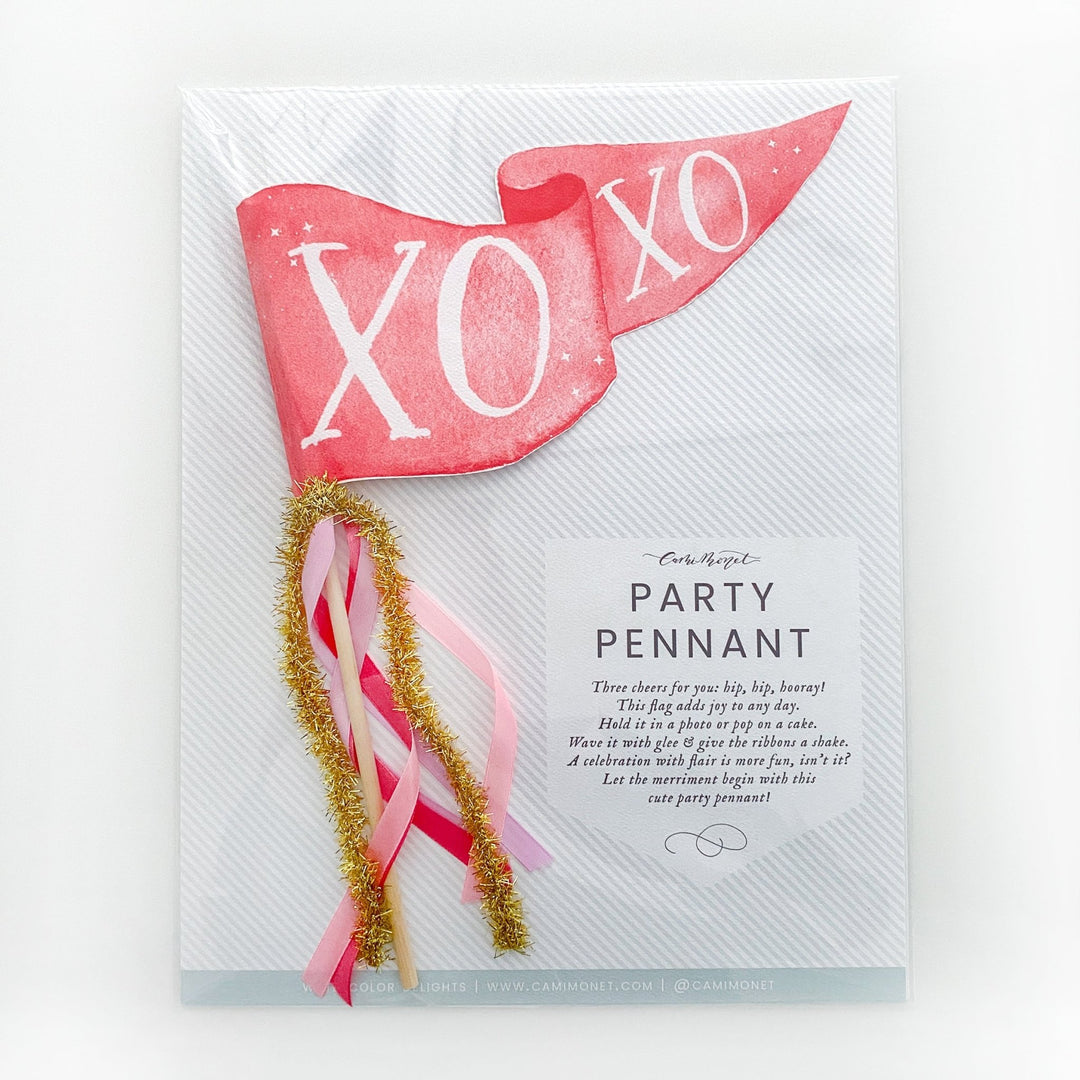 Red XOXO party pennant packaged in a cello sleeve with a printed Party Pennant poem card
