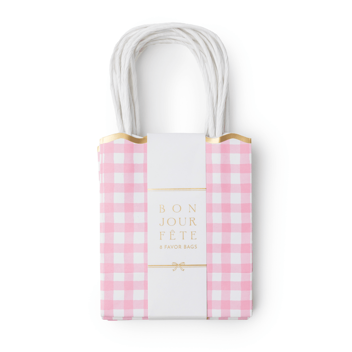 Petal pink gingham paper favor bags with scalloped trim for a birthday party or baby shower