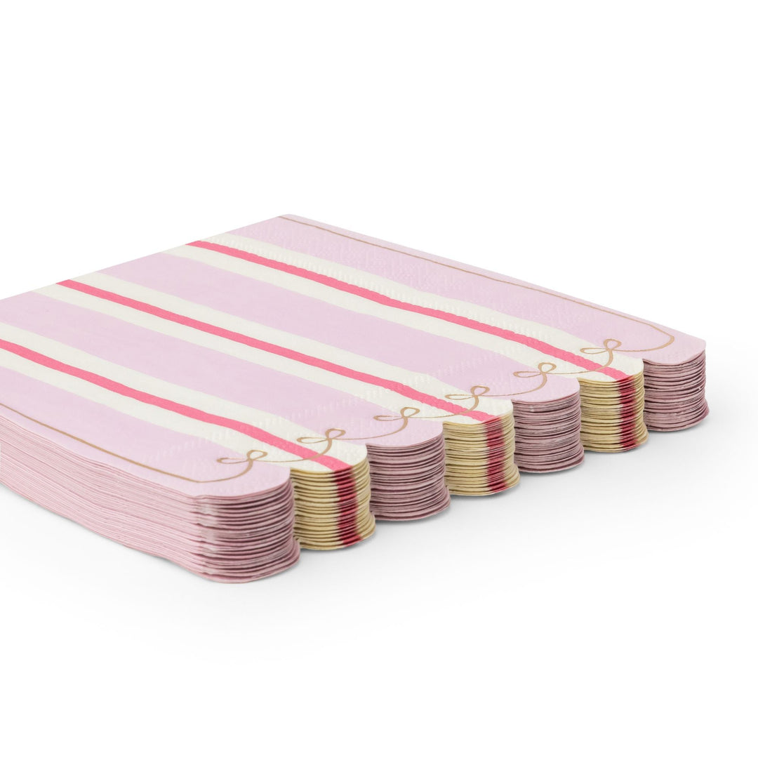 Stack of petal pink stripe napkins showing the folded striped edges