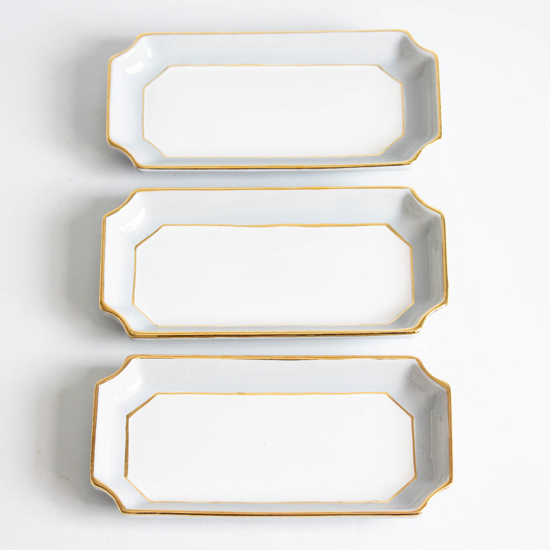 Three light gray petite valet trays stacked vertically with gold trim, ready for bridesmaid gifting