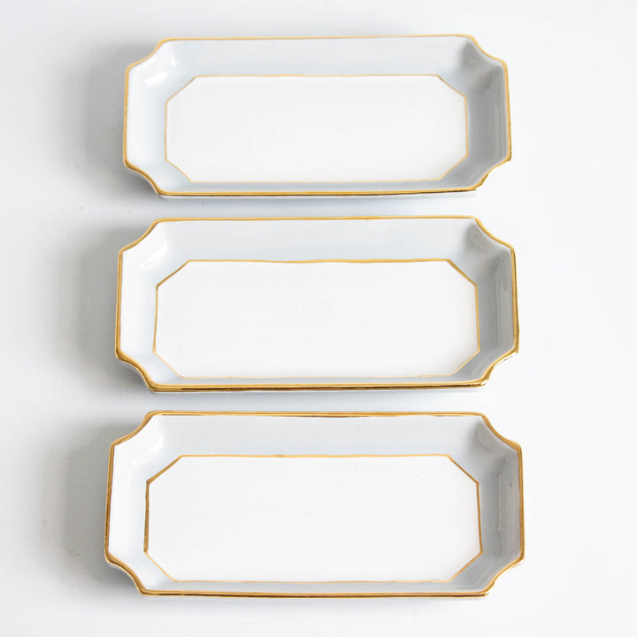 Three light gray petite valet trays stacked vertically with gold trim, ready for bridesmaid gifting