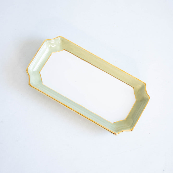 Sage green two tone petite valet tray with a gold rim on a white backdrop, a fresh housewarming gift