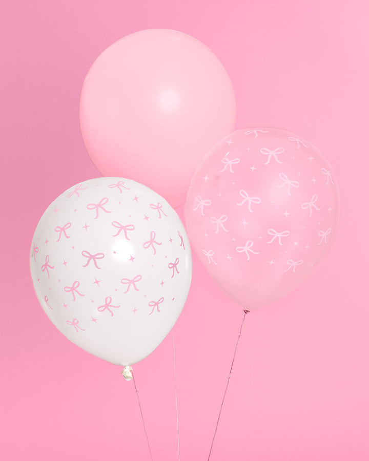 Detail of light pink and white pink bow latex balloons