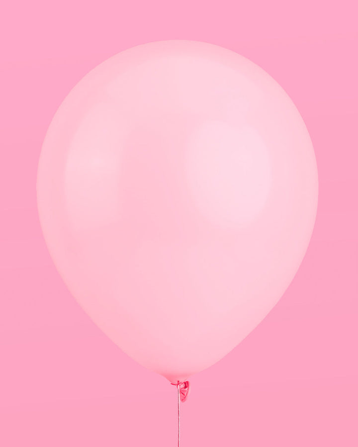 Styled pink bow latex balloons for a bridal shower or coquette party