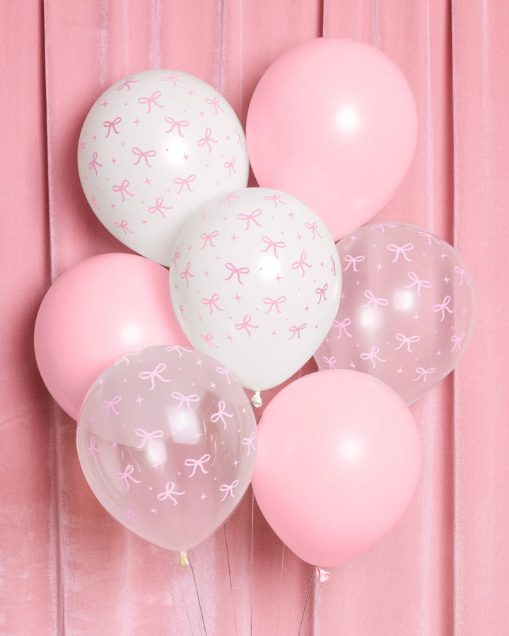 Bunch of pink bow latex balloons in white, light pink, and clear with a pink bow print