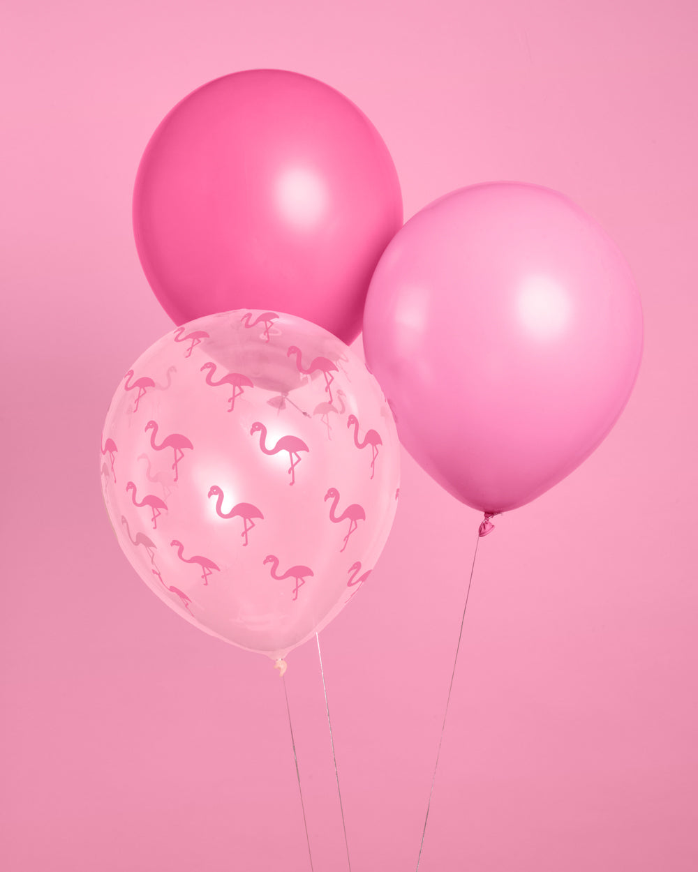 Pink flamingo latex balloon set in light and dark pink with a clear flamingo-print balloon