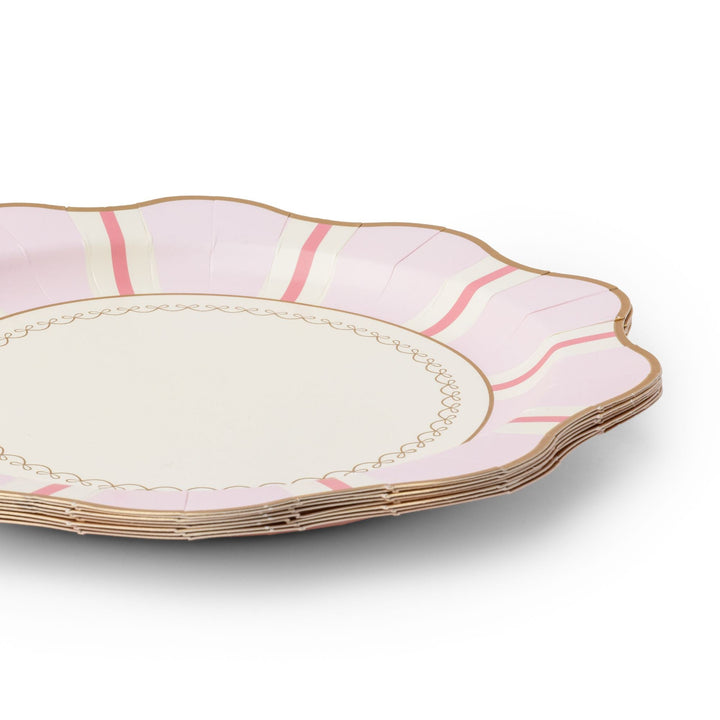 Stack of petal pink regency stripe dinner plates showing the striped scalloped edge