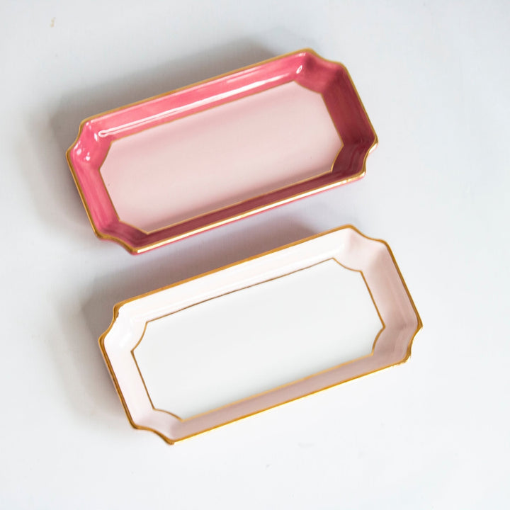 Rose pink and pale blush petite valet trays side by side with gold rims, a pair for gift giving