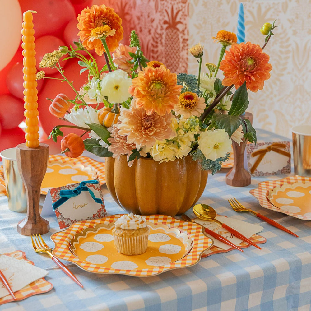 Thanksgiving table setting with Liberty print plates, napkins, cupcakes, and matching place cards