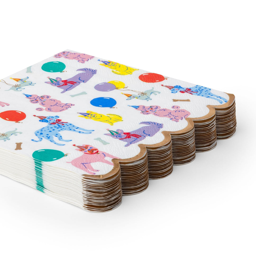 Stack of puppy dog party napkins showing the folded multicolor print edges