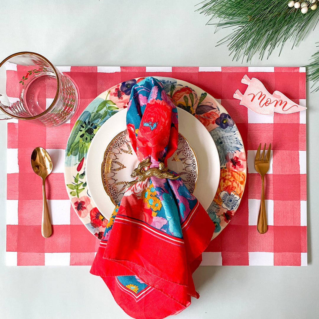 Red and white watercolor gingham check paper placemat from a tear-off pad of 25