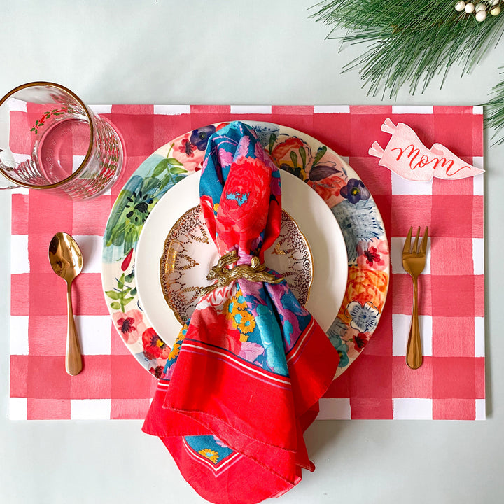 Red and white watercolor gingham check paper placemat from a tear-off pad of 25