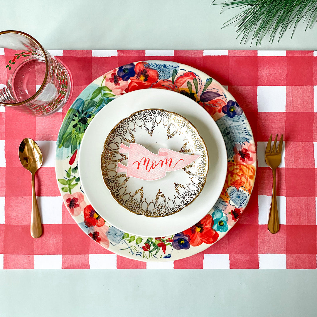Red and white watercolor gingham check paper placemat from a tear-off pad of 25