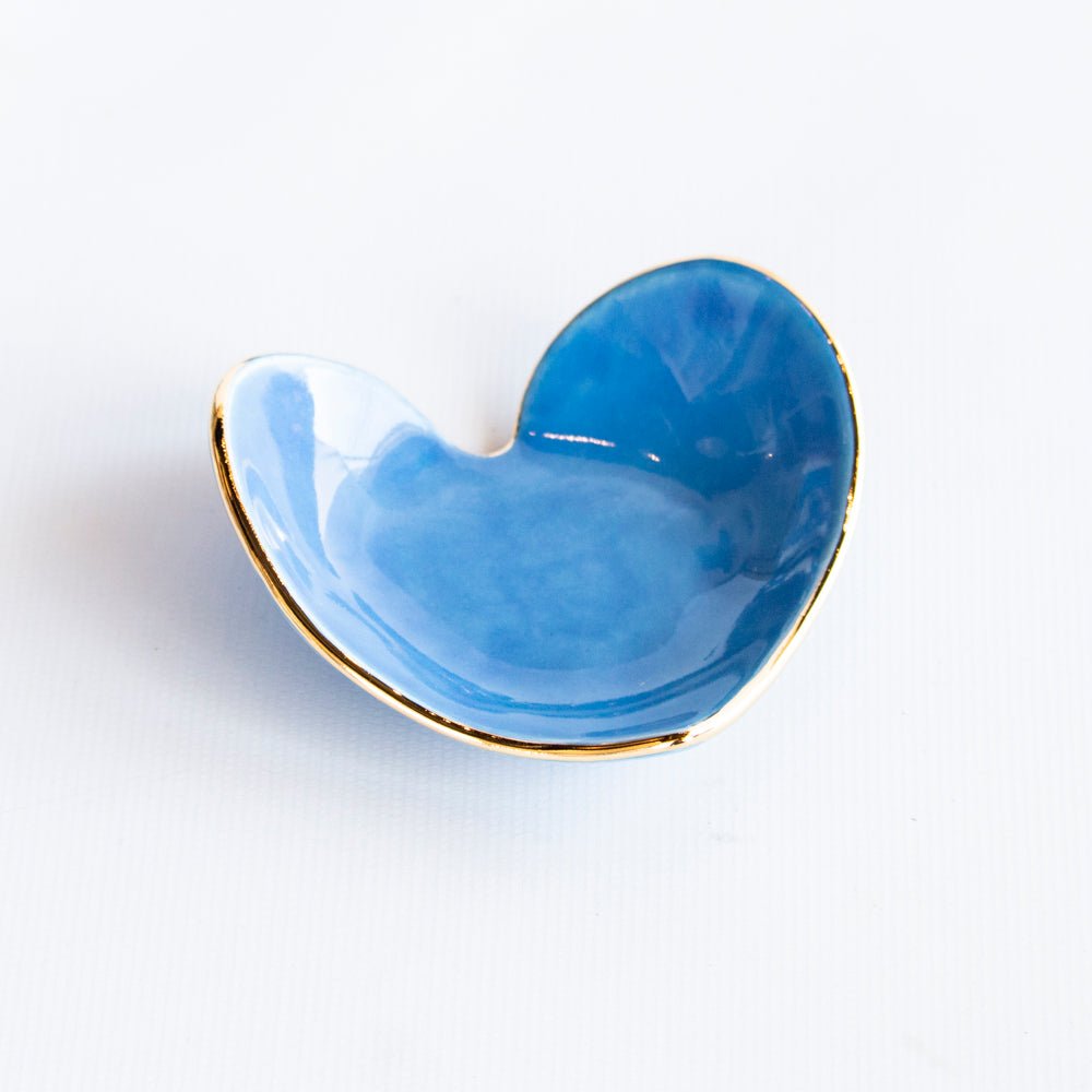 Bright Aegean blue heart ring dish with a gold rim, low side angle