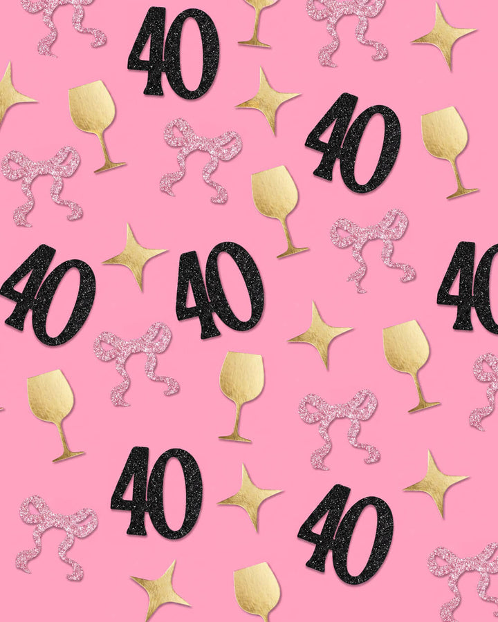 40th birthday confetti scattered across a pink surface