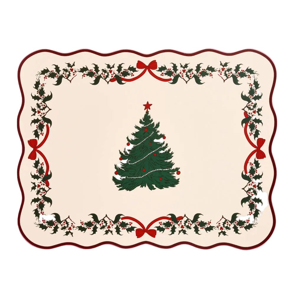 Cream paper placemat with a scalloped edge, green Christmas tree, and holly border
