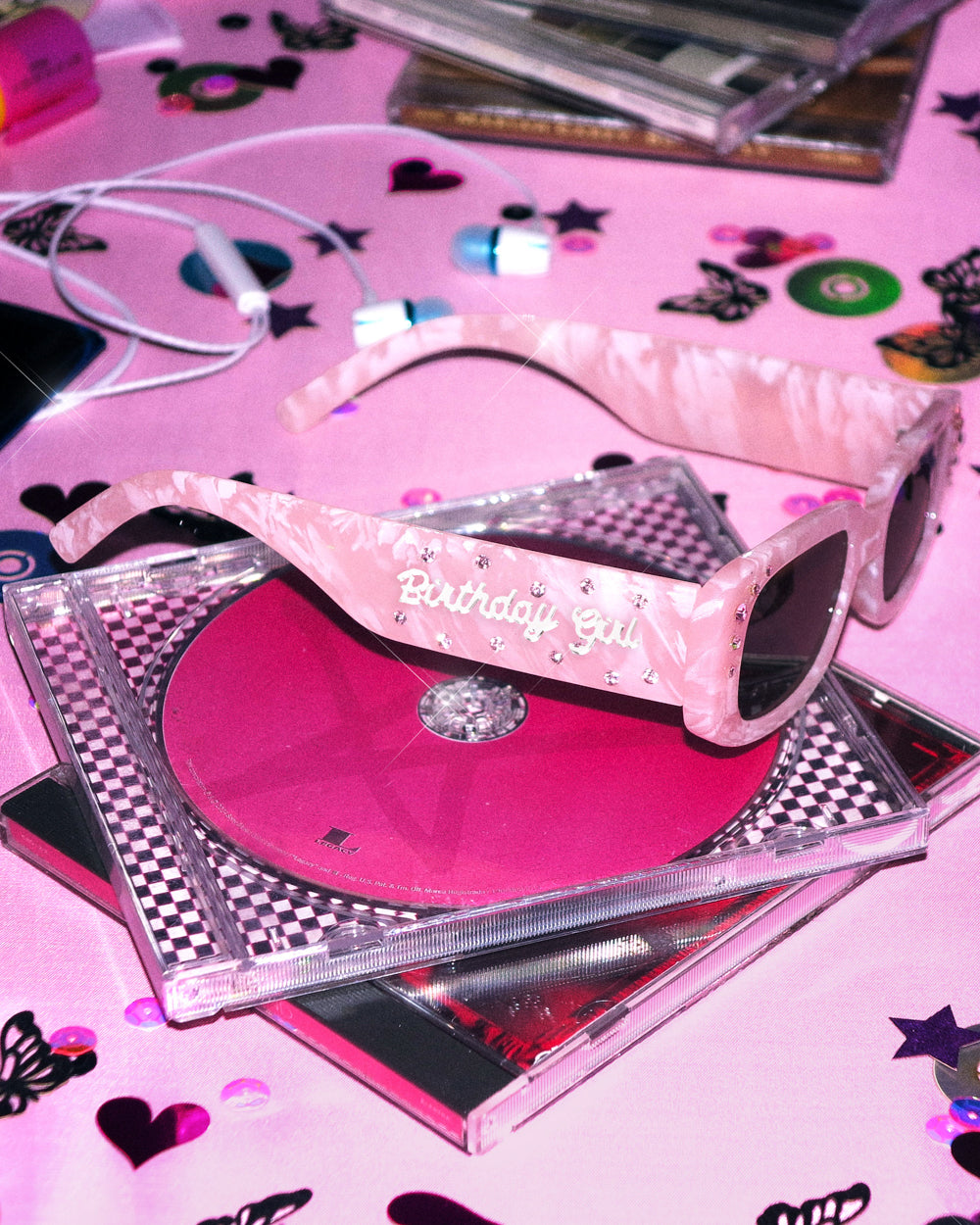 Pink Birthday Girl sunglasses on a pink CD with silver script on the arm