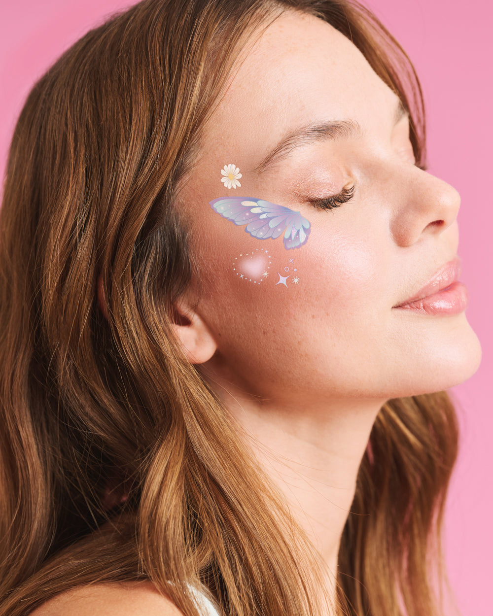 Iridescent blue butterfly face tattoo on a woman's cheekbone