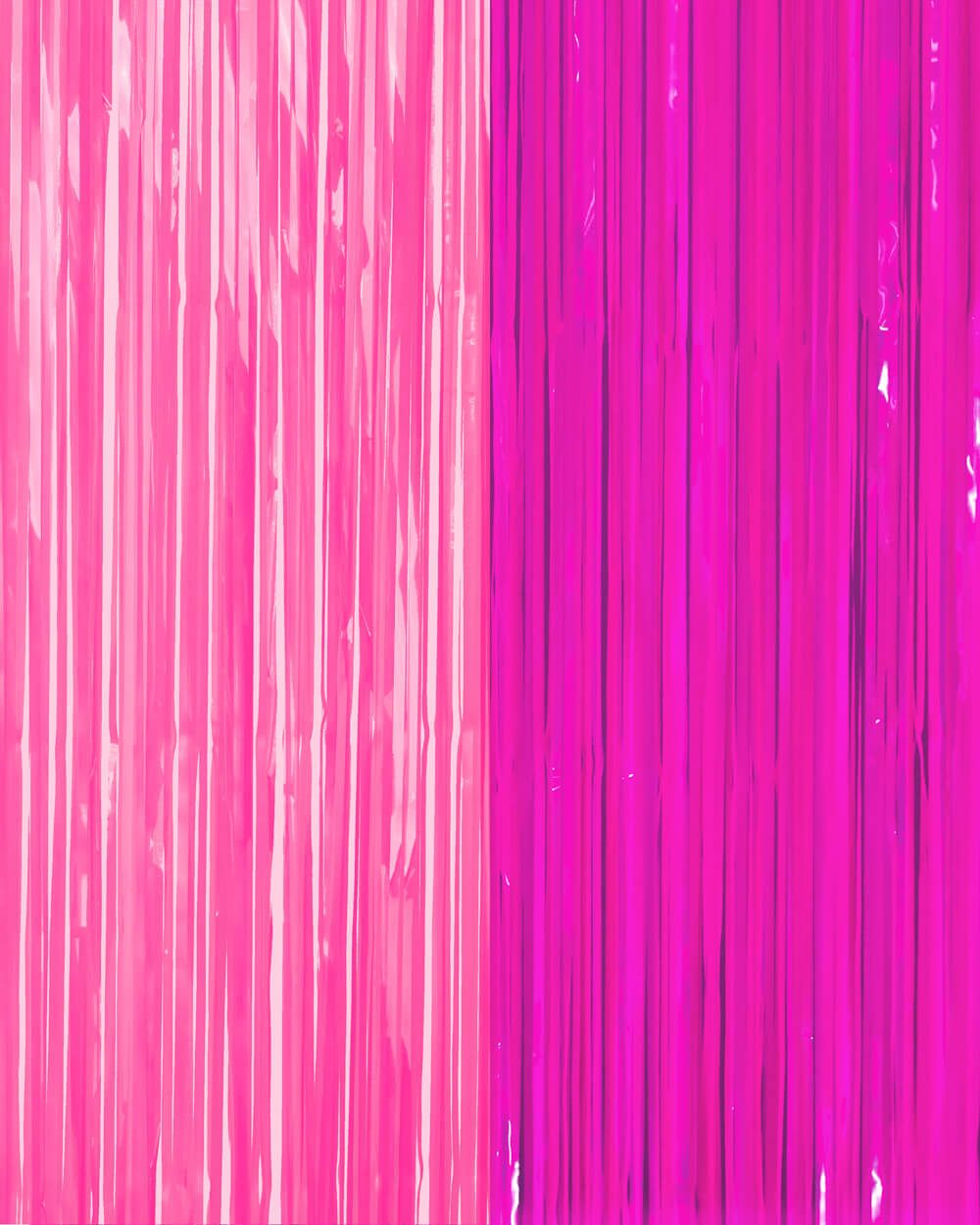 Bright pink and magenta fringe strands layered on a neon party curtain