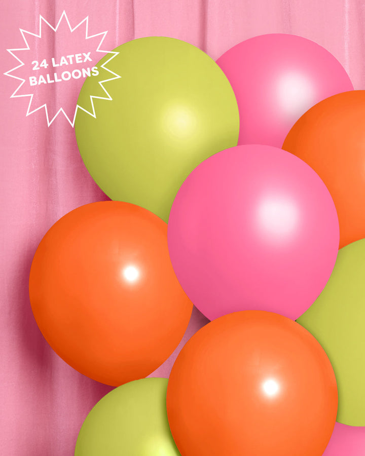 Tropical balloon garland styled at a party