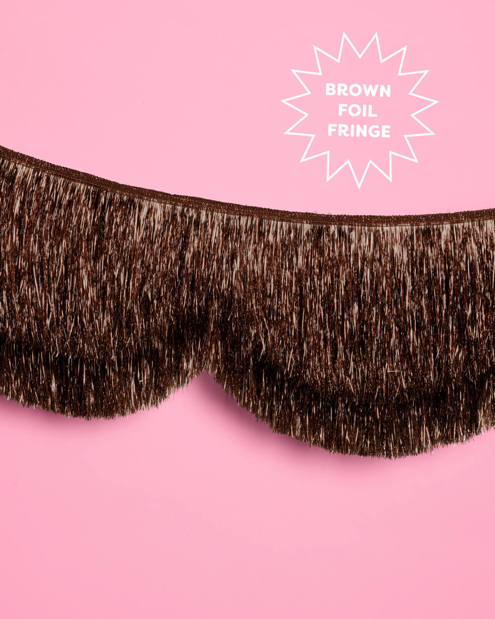 Close-up of the espresso brown foil fringe showing the 8 inch fringe length below a scallop