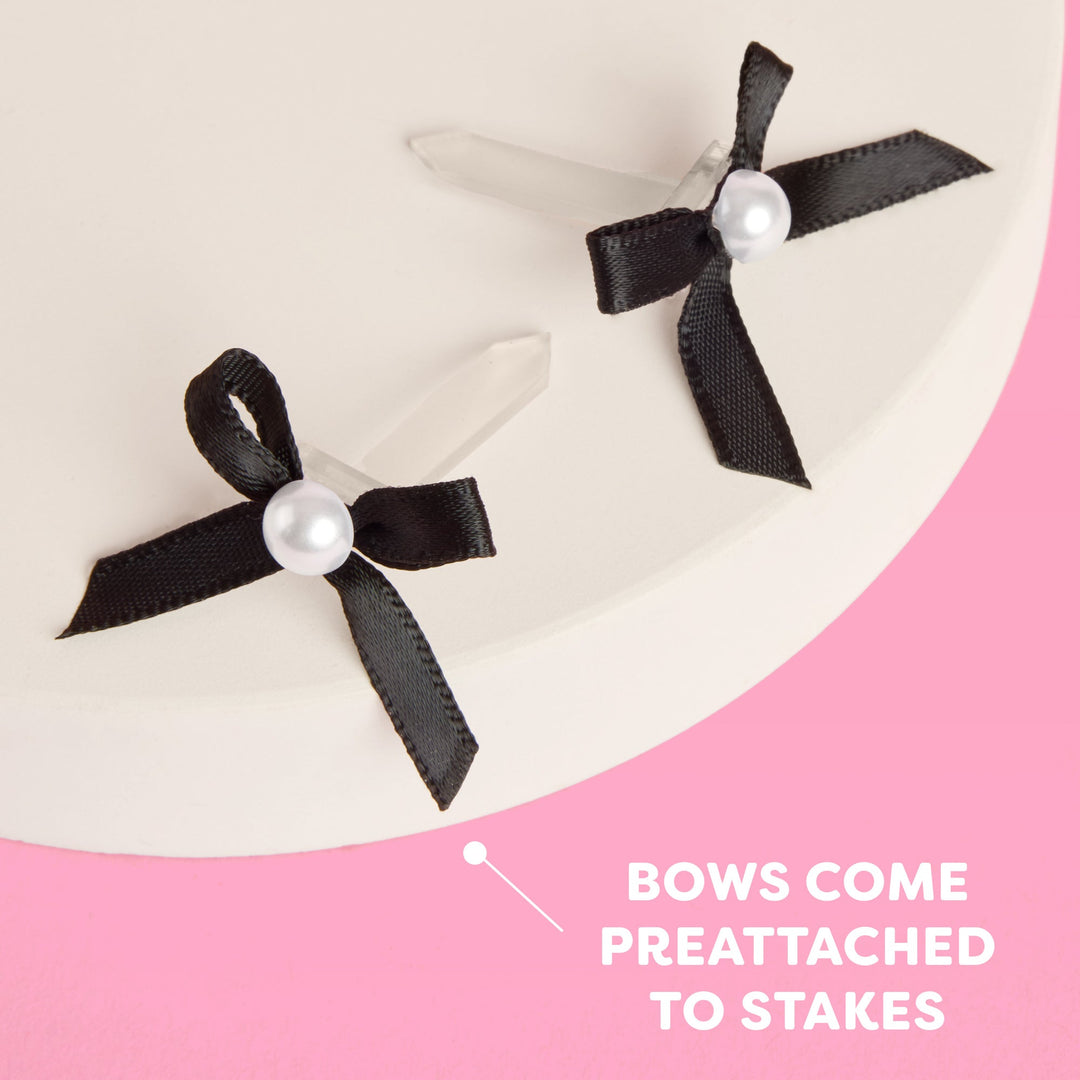 Black and pearl bow cake toppers shown with detachable spikes, set of 12 for dessert tables